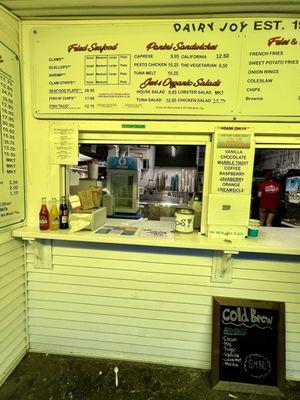 Dairy Joy Menu is above the order window. Old School Classic Soft Serve Ice Cream since 1961 & Free Parking & Outdoor Picnic Tables Weston