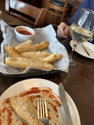 These are the unique and delicious Italian Fries w/Parmesan cheese and marinara sauce. It was new to us. It was delicious! $4 happy hour.