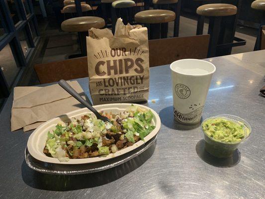 Chicken bowl, chips, guac and water 14.00$