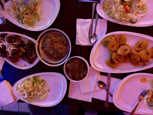 Fried plantains, rice and beans, stewed eggplant, fried meat platter (pork, chicken, and turkey), plus salads for everyone