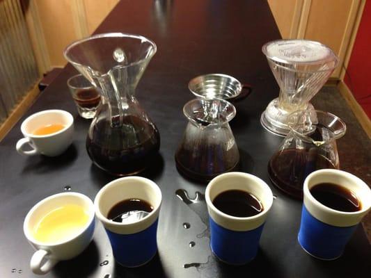 Cupping, or tasting, through three different techiques: Chemex, Melitta, and Clever (left to right).