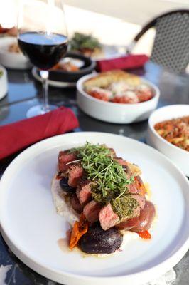 8 oz Ribeye Steak Dinner with whipped feta, fingerling potatoes, Italian peppers, and chimmichuri