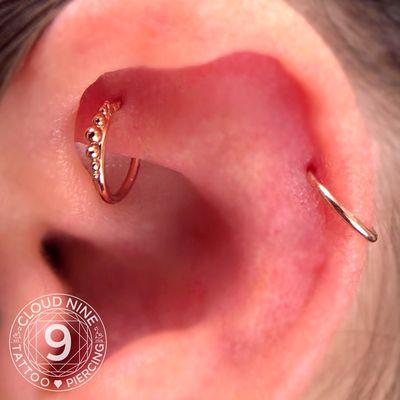 Upgrade healed rook piercing jewelry with 14Kt yellow gold jewelry. Piercing by Karri.