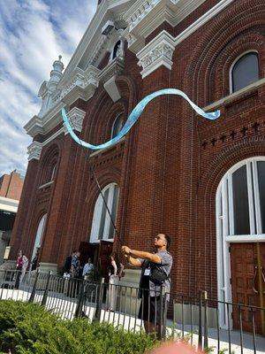 Banner Twirler at the 2024 NPM Convention Closing Eucharist