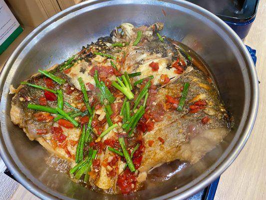 Dry pot fish head with preserved hot chili peppers