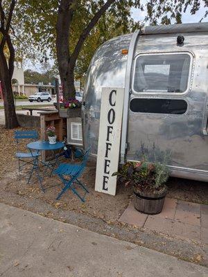 The waiting table right by the airstream.