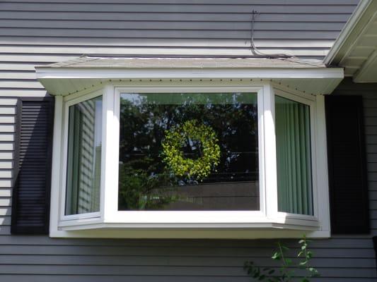 Replaced a bow window with a bay window and built a new roof over the window