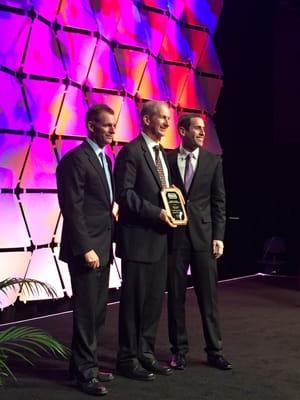 Tom accepting the 2016 Maryland Quality Dealer of the Year award from the NIADA