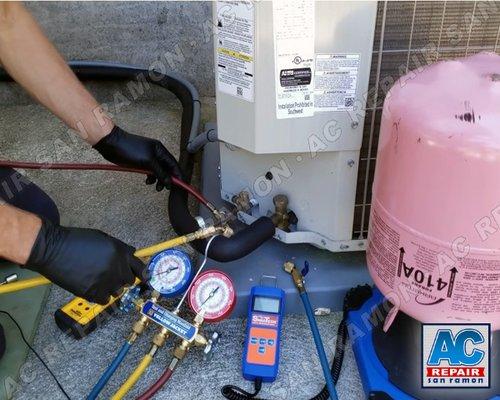 Our air conditioning repair technician is shown here performing thorough cleaning and servicing on an HVAC system.