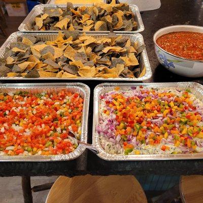 Guacamole with onions peppers and tomatoes. (L) Spinach & artichoke dip with bell peppers and red onions (R)