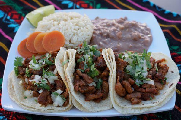 it comes with onions,cilantro and a side of beans and rise and whatever meat you want.