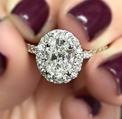 Beautiful Oval Center Stone  in Platinum Diamond Halo