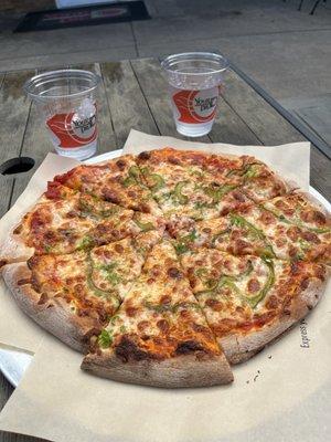 A 14" pepper and jalapeño pizza