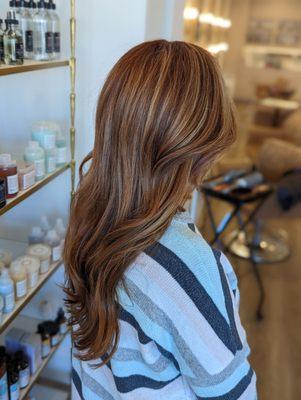 Warm red hair with highlights