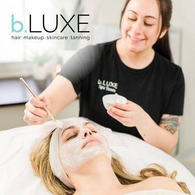 Our aesthetician, Corinn Bradford, applies a targeted facial mask during one of our luxury b.LUXE Spa Facials