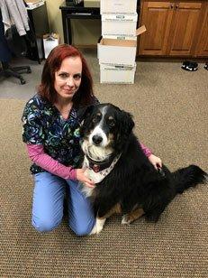 One of our Sales Representatives and her Service dog greet everyone with a smile