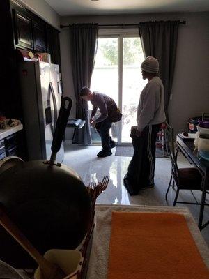 Steve Inspecting the oven fire with my son standing by.