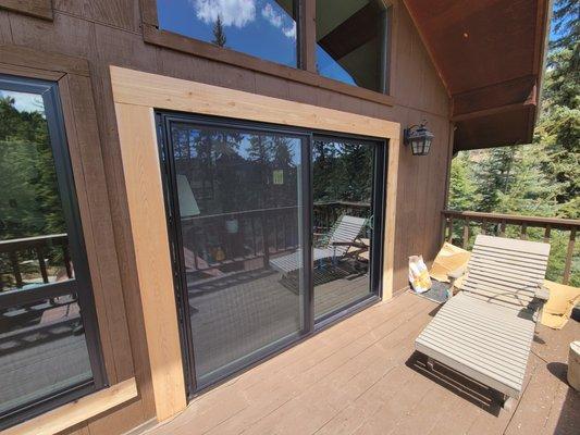 Black frame patio door installed by New Windows for America