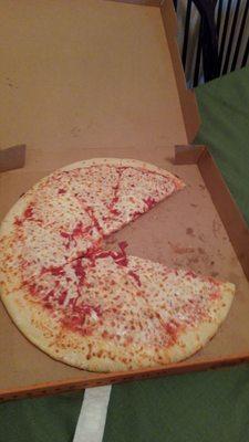 A cheese pizza that looks like Pac Man.