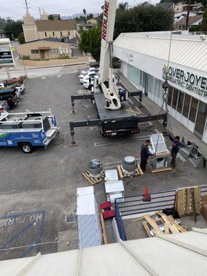 Crane lift at wingstop new commercial install