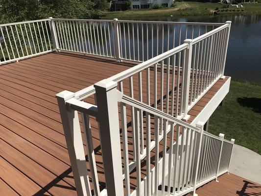 Elevated Trex Transcend Tropical Tiki Torch deck build. Trex Signature white aluminum handrails. Urbandale, IA