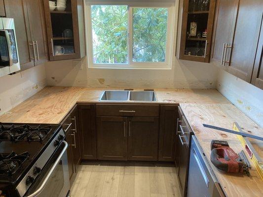 Installing the plywood sub countertop.