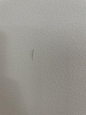 Small dent in wall from old apartment