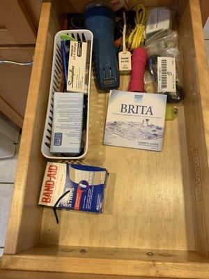 A utility drawer. Everything in here needs to be explained why is it in the kitchen drawer