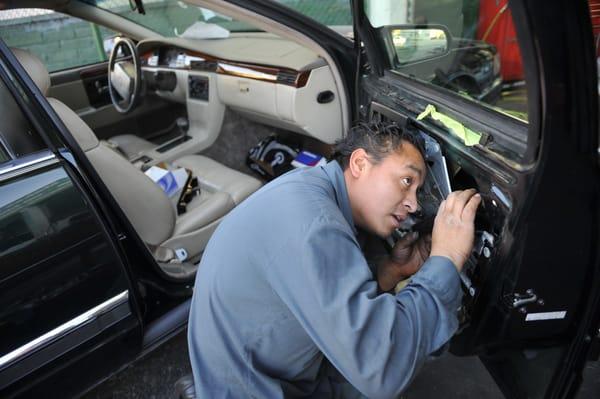 Eddie fixing a door regulator.