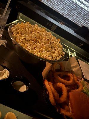 Popcorn brew house burger and onion rings