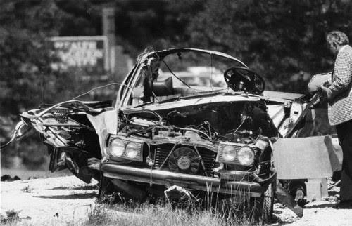 Aftermath of the car bomb attached to the underside of Michael Cagnoni's silver 1979 Mercedes-Benz.