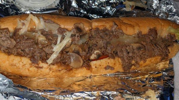 Steak sub w/ onions, mushroom, lettuce, tomatoes, and provolone. Good stuff.(Don't let it sit too long before you eat it)