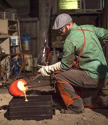 Yori pouring bronze in the foundry