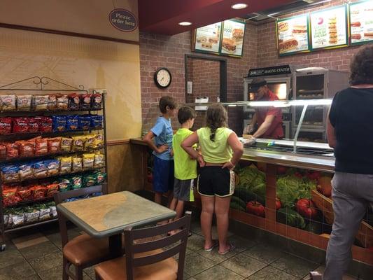 My grandkids ordering the meal at Subway.