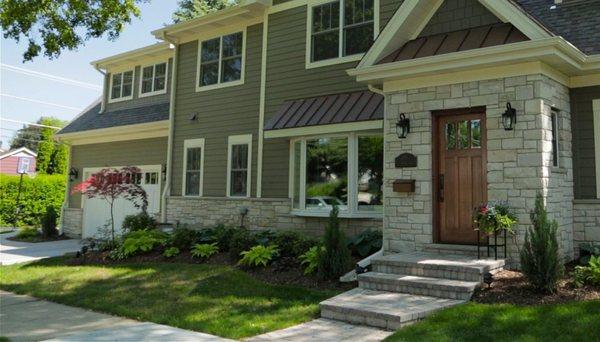 Vinyl siding with man-made stone entry for stunning curb appeal!