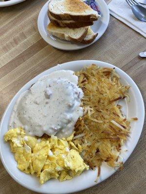 Chicken fried steak, scrambled eggs, hash browns, and sourdough toast