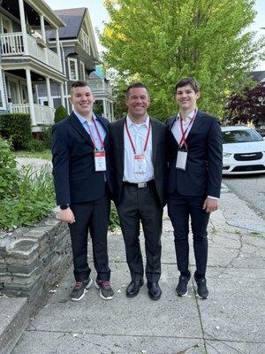 13 & 15 year old sons wearing their suits from Suits 20/20. In sneakers here, but the camel color shoes from Suits 20/20 look much better!