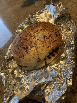 Toasted everything bagel with cream cheese, avocado and tomato.