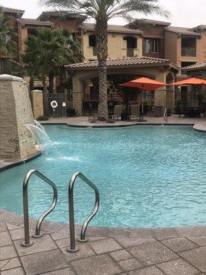 View of outdoor kitchen and ramada from pool, December 2018.