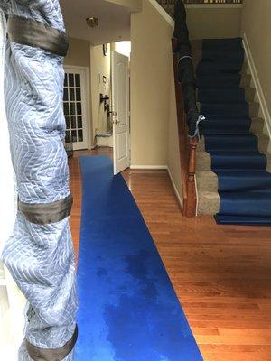 Floor runners, door jamb protectors, and railing pads are put to use on every move.