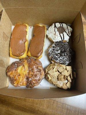 two Boston cream, Apple fritter, Oreo, Cinnamon Toast Crunch & reeses donuts!