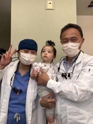 Dr. Leung and Dr. Leung and a baby who wishes she were born to parents who let her watch TV.