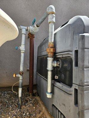 Pool water heater trap installation and heater maintenance.