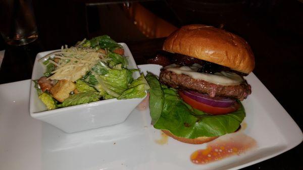 House Bacon cheese Burger with side Caesar salad.