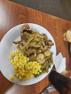 Steak with mushrooms and onions with green beans and corn