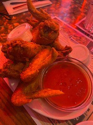 Huge chicken wings with a side of buffalo sauce