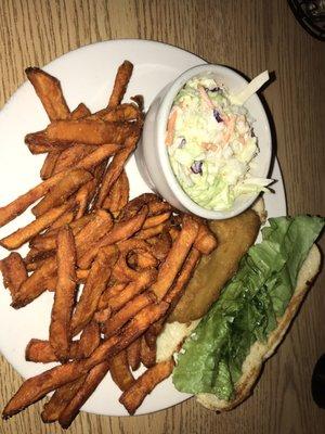 Lunch portion fish sandwich with sweet potato fries and Cole slaw