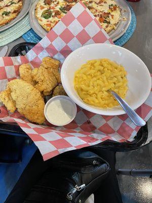 Chicken tenders with Mac and cheese. Fresh goodness and not overly breaded! Happy dance!