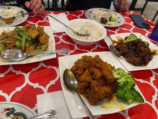 Left to right: Stir fry tofu and vegetables Orange chicken General TSO beef  All comes with generous amount of rice!