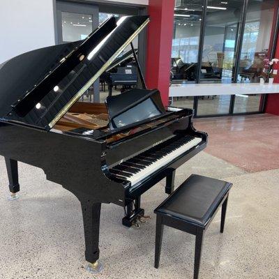 Grand piano in our new piano store located at the Journal Center